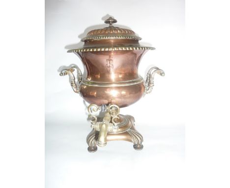 A good quality 19th century copper samovar raised on four rounded supports with squared base, set beneath scrolling turned ha