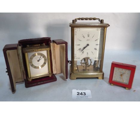 Two Swiss Looping alarm clocks, one leather cased and a German Schatz brass clock 5' high