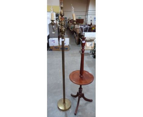 A mahogany lamp standard and a brass three light lamp standard