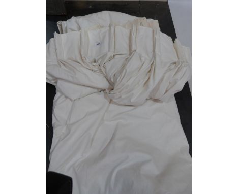 A pair of white cotton lined curtains each 100' wide x 90' drop