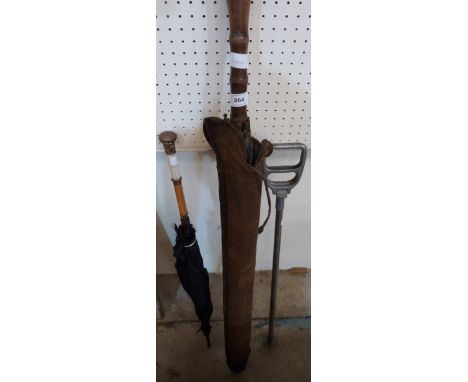 A Victorian umbrella, another and a shooting stick