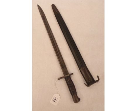 A sword bayonet and scabbard dated 1913. Length of blade 16¾'