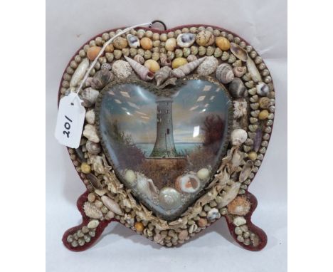 An Edwardian shell-work souvenir diorama, of heart form, with lithograph in colours depicting a lighthouse, mounted with shel