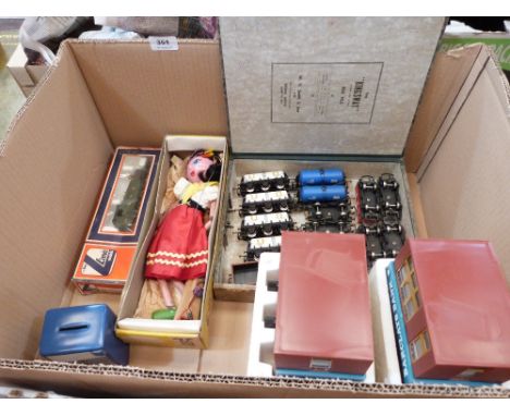 A collection of model railway rolling stock, a Pelham puppet, two 1960s money safes and a money box