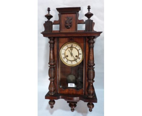 A Vienna style walnut wall clock with two train movement. 27' high