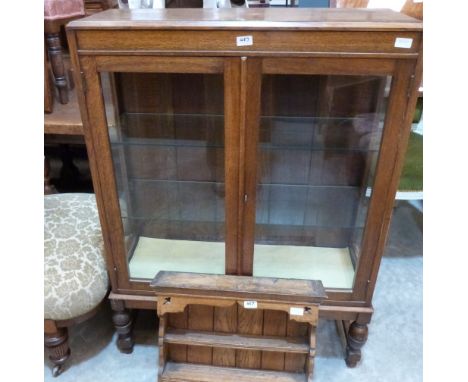 An oak glazed china display cabinet and an oak hanging spice rack