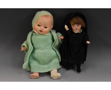 Dolls - a German porcelain headed doll, sleeping blue black eyes, open mouth, light brown hair, card body, composite limbs, b