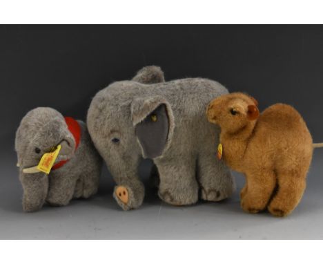 Steiff Stuffed Toys - a standing Elephant, large two tone ears, turned trunk, blue eyes, button, no tag;  another smaller Jum