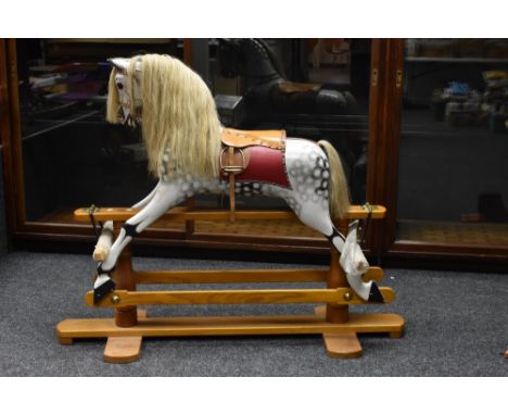 A handmade rocking horse, by Jim Presby, Wednesbourgh, dapple grey body, leather saddle and tack, light grey mane and tail, c