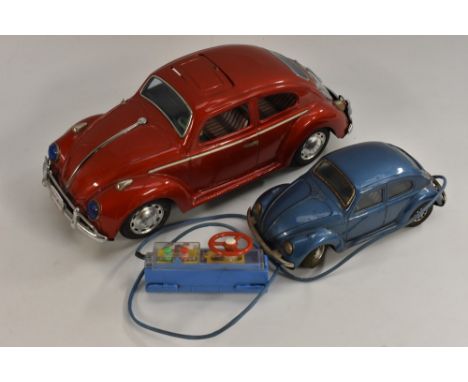 Bandai Toys - a 1960s battery operated tin plate Volkswagen Beetle Car, red. clear plastic engine cover, lithographed interio