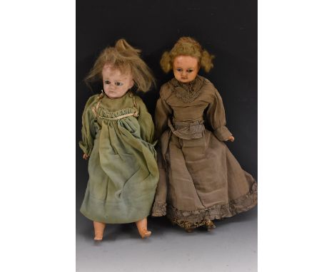 A 19th century wax shoulder doll, blue eyes, moulded mouth, light brown wig, cloth body, waxed over lower arms and legs,  wea