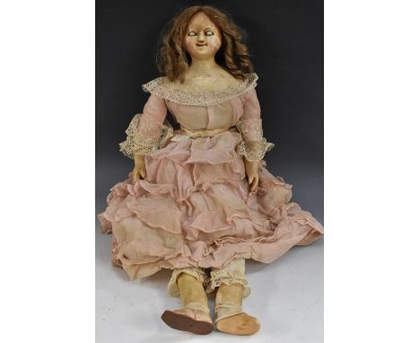 A 19th century wax shoulder doll, sleeping eyes, closed mouth, light brown ringlet wig, cloth body, waxed over lower arms and