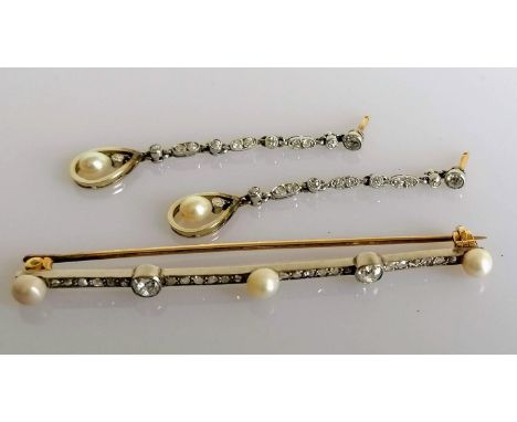 An Art Deco diamond and pearl bar brooch, 70mm. with a pair of near matching earrings, each 50mm, unmarked, 9.65 no backs to 