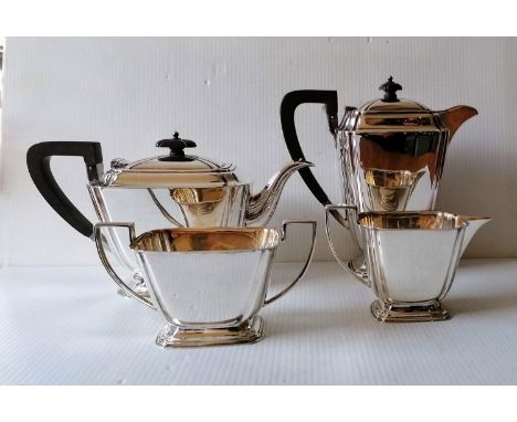 An Art Deco silver four-piece tea/coffee service with stylized design, reeded handles on stepped bases by Atkin Brothers, She