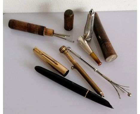 A rolled gold Parker 51 fountain pen; two treen needle cases; silver cheroot holder, swizzle stick and a gilt propelling brid