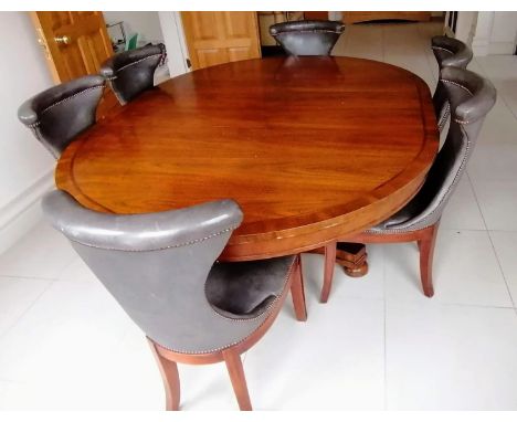 A Henredon for Ralph Lauren Polo oval extending dining table, plain frieze, one extra leaf on a fluted column support and qua