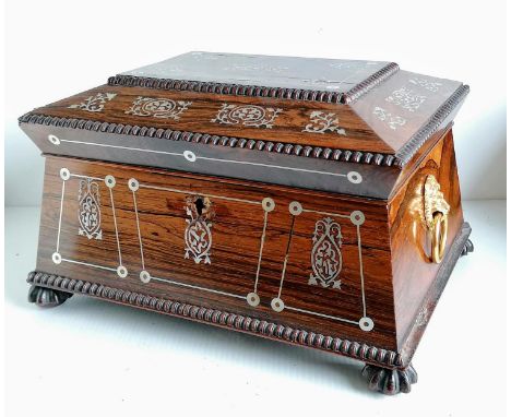 A Regency rosewood sarcophagus tea caddy converted to a jewellery box with mother of pearl inlay on carved feet, later side h