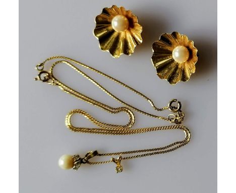 A pair of mid-century gold shell clip-on earrings with pearl decoration and a chain with two small pendants, all hallmarked 9