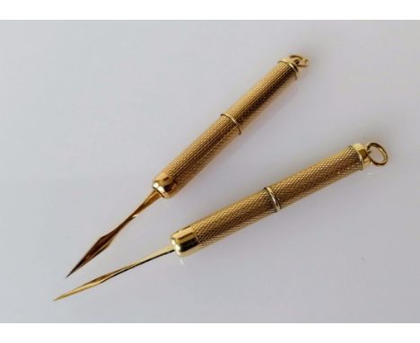 Two 9ct yellow gold tooth picks with engine turned design, each 7 cm extended, hallmarked, 12.32g
