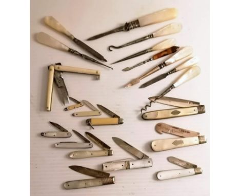 An assortment of eleven Edwardian mother-of-pearl and ivory-handle pen knives, some with hallmarked blades, folding scissors,