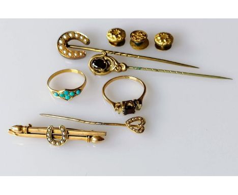 An Edwardian seed pearl horseshoe brooch, stamped 15ct, 2.4g; a similar pin brooch, a garnet set ring (one stone missing) bot