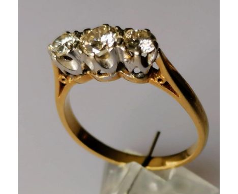 A three-stone diamond ring, the brilliant-cut graduated diamonds measuring 0.50, 0.25 (x2) carats, assessed colour K/L, clari