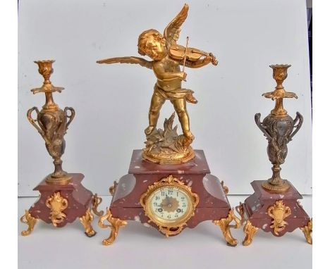 A 19th century French figural and rouge marble mantel clock garniture, dial 8cm diam, Arabic numerals, gilt scroll mounts, su