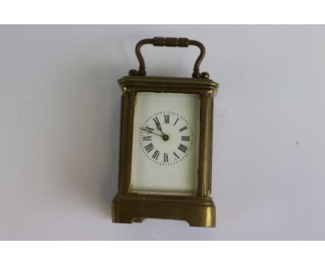 Vintage key wind Miniature Brass Carriage Clock with Enamel dial and glazed panels, measures approx 7 x 5 x 4.5cm