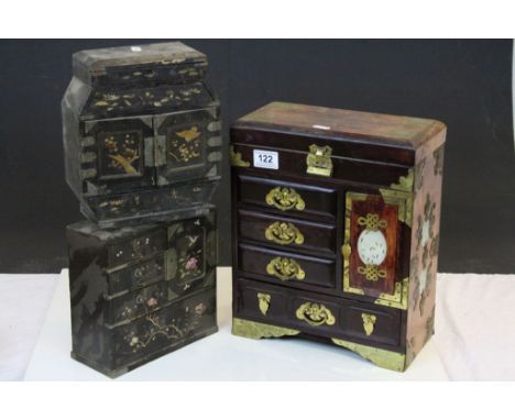 Three vintage Oriental multi drawer Trinket or Jewellery boxes, all wooden, the larger one with Brass fittings and inset pier