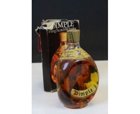 1970's Bottle of Dimple Haig Old Blended Scotch Whiskey in original box and wire mesh on bottle, un-opened