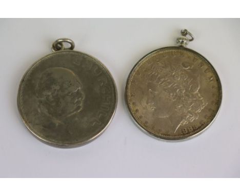 Two vintage pendant mounted Coins to include a Churchill Crown &amp; an 1886 Morgan Silver Dollar, mint mark "O"