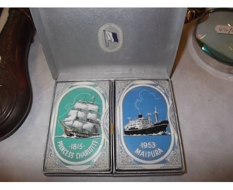 A twin pack of sealed shipping design playing cards in fitted lift-top box