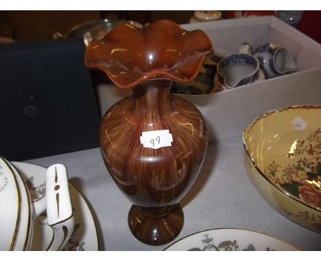 A Linthorpe Pottery vase on a brown coloured ground