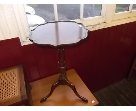 A mahogany tripod wine table by Waring & Gillows