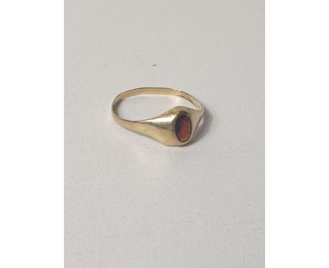 9ct gold oval garnet signet ring, size P. Shipping Group (A). 