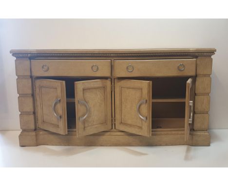 A substantial continental sideboard in crème factory finish. Having two long drawers featuring ring pulls, over two&nbsp;doub