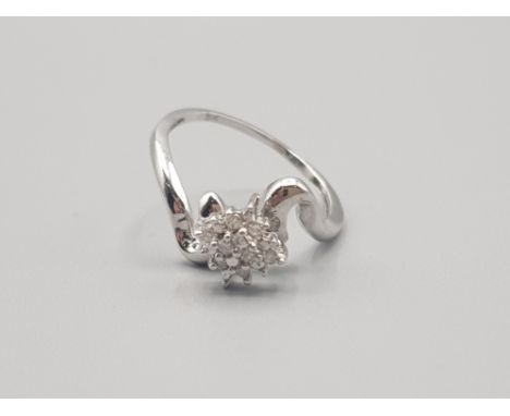 Ladies 9ct white gold diamond cluster ring comprising of eight brilliant round cut diamomds size l 1.5g gross