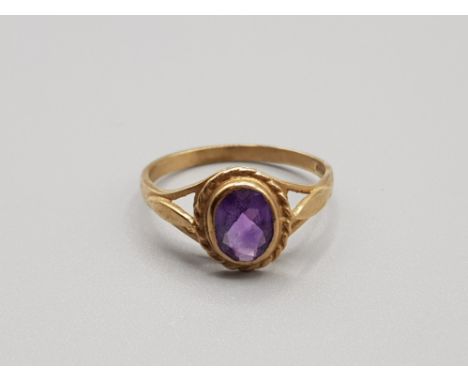 Ladies 9ct yellow gold amethyst stone ring featuring a oval amethyst stone set in a rub over setting size p 2g gross