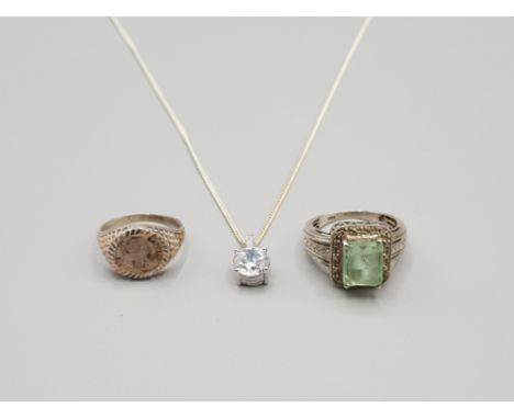 3 silver items includes solitaire cz pendant and chain 1 silver coin ring 1 silver green stone ring