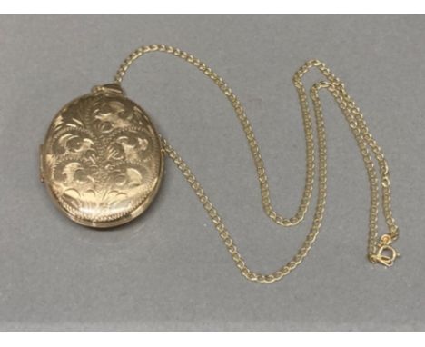 A 9ct yellow gold locket on 9ct yellow gold chain 9.8g gross
