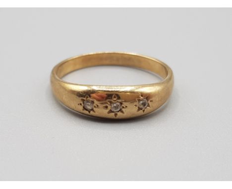 9ct yellow gold 3 stone ring comprising of white stones set in a rub over setting size q 2.7g gross