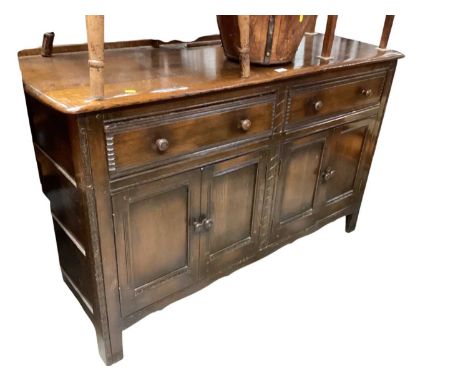 Ercol sideboard with two drawers and two panelled doors below, 144cm wide, 51cm deep, 89cm high