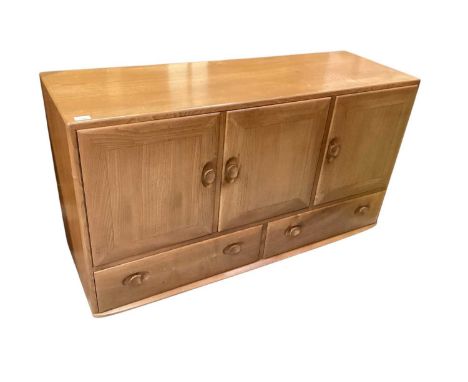 Ercol sideboard with three doors and two drawers below, 129cm x 43cm