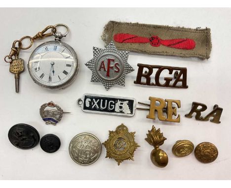 Continental silver cased fob watch, together with a group of cap badges and buttons including a silver Tank Regiment pin 