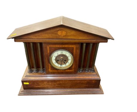 Edwardian mahogany mantle clock in an inlaid architectural case.