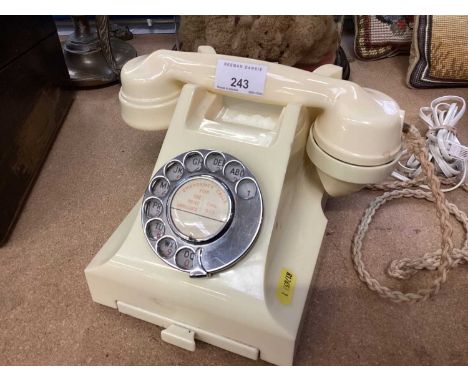 Vintage cream bakelite telephoneWe cannot confirm if it is in working order but it appears to be in good condition
