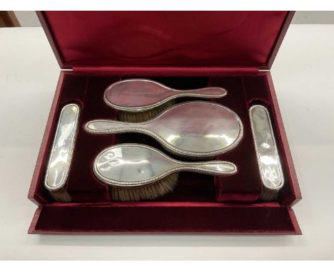 Garrard &amp; Co. Silver five piece dressing table set in fitted red leather case