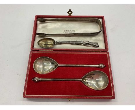 Pair of silver spoons in fitted case, pair of silver sugar tongs and a Chinese silver teaspoon in the form of a rifleTotal we