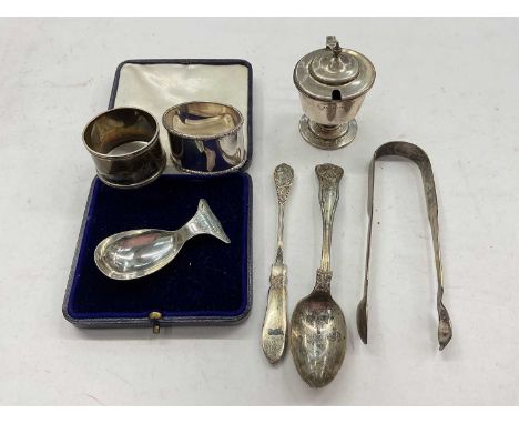 Group silver items to include two napkin rings, pair sugar tongs, mustard pots and flatwareTotal weight 204 grams
