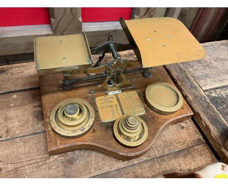 Set of oak and brass postal scales by Benetfink &amp; Co